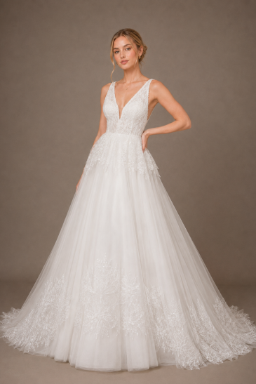 femme dans une robe de mariée princesse en tulle brodé à paillettes